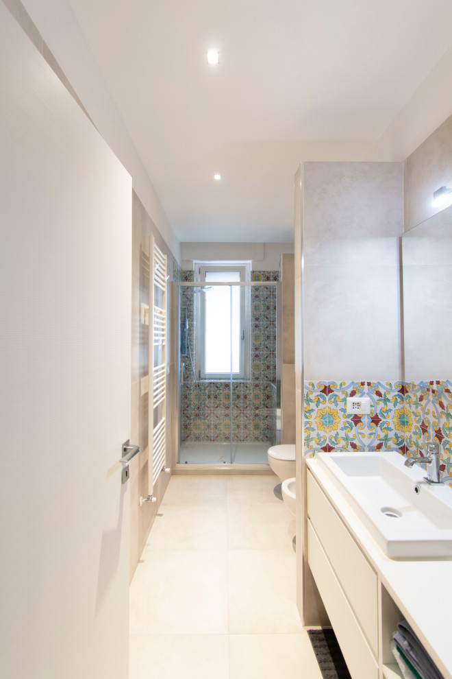 Medium sized contemporary bathroom in Milan with light hardwood flooring, brown floors and a drop ceiling.