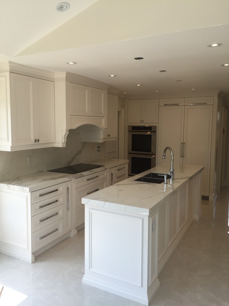Example of a transitional kitchen design in Toronto