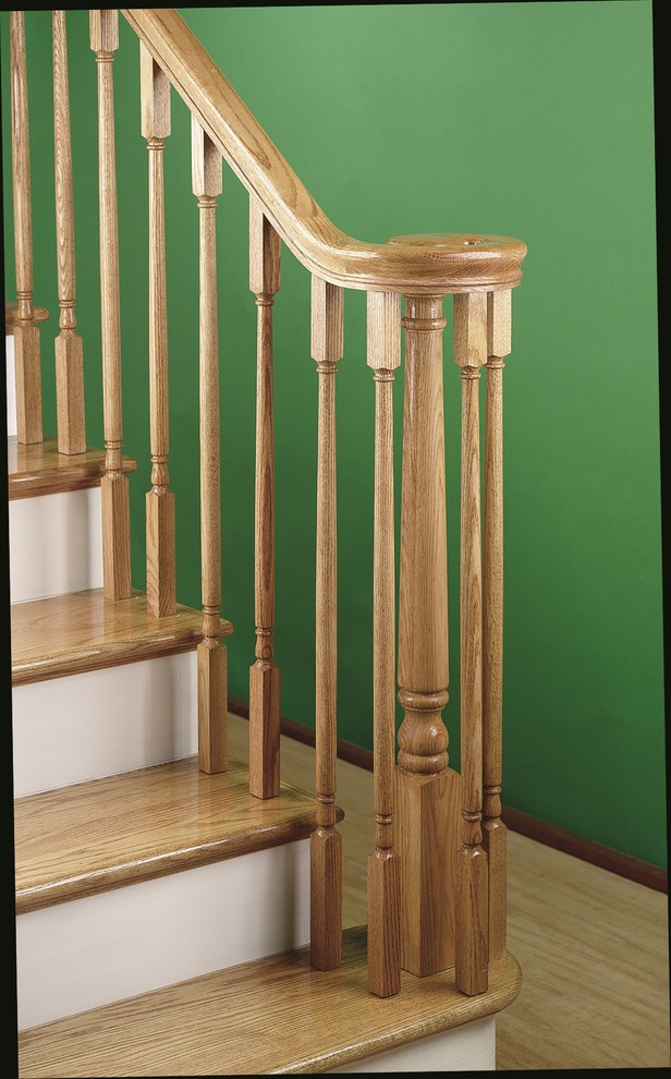 Photo of a traditional wood l-shaped staircase in San Francisco with painted wood risers.