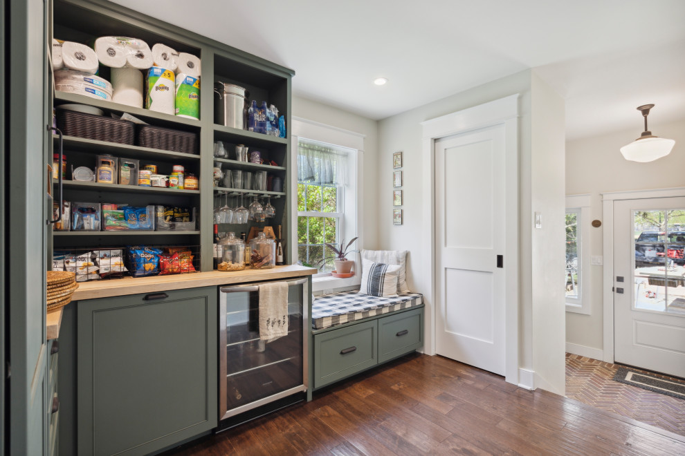 Inspiration for a medium sized rural l-shaped kitchen pantry in Philadelphia with open cabinets, green cabinets, wood worktops, stainless steel appliances, dark hardwood flooring, no island, brown floors and yellow worktops.