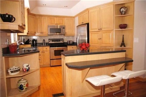 Example of a transitional kitchen design in Toronto