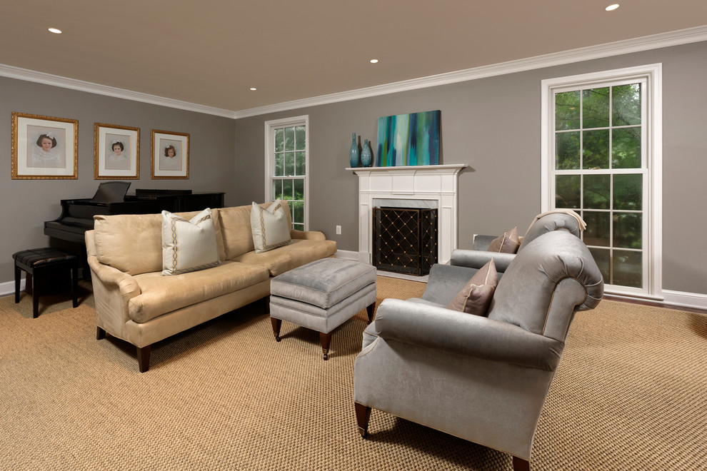 Photo of a contemporary living room in DC Metro with grey walls, carpet and a standard fireplace.