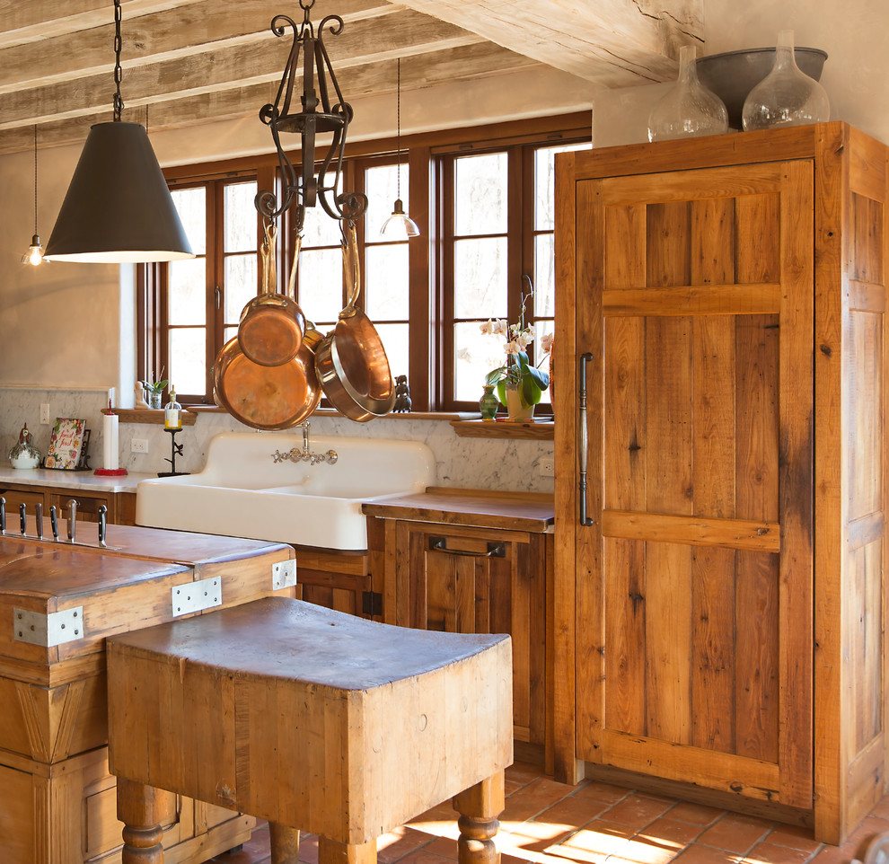 Inspiration for a mid-sized country l-shaped eat-in kitchen in Nashville with a farmhouse sink, shaker cabinets, panelled appliances, with island, distressed cabinets, marble benchtops, white splashback, stone slab splashback, terra-cotta floors, red floor and white benchtop.