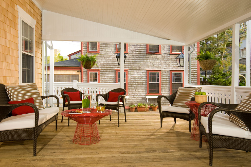 Design ideas for a traditional backyard patio in Boston with decking and a roof extension.