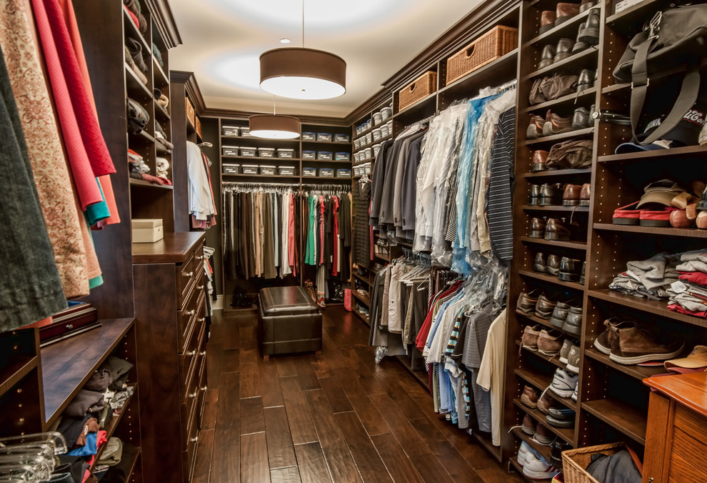 Design ideas for a traditional men's dressing room in Los Angeles with open cabinets, dark wood cabinets and dark hardwood floors.