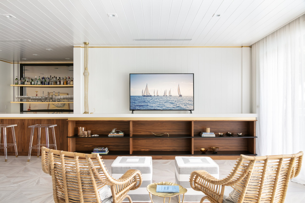 Inspiration for a mid-sized contemporary open concept family room in Tampa with a home bar, white walls, a freestanding tv, beige floor, timber and planked wall panelling.