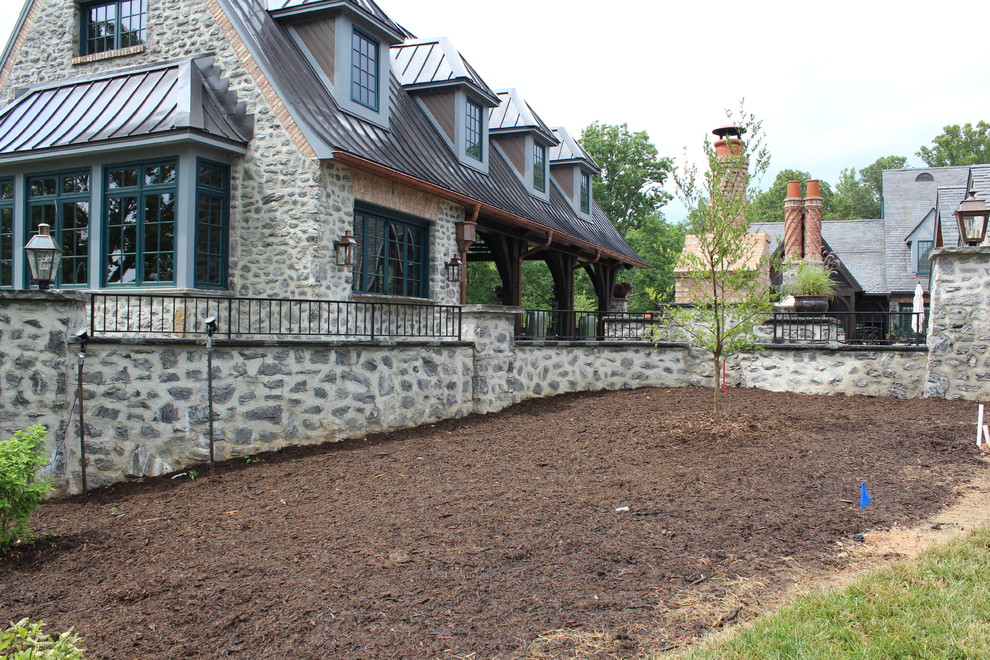 Mid-sized mountain style backyard patio photo