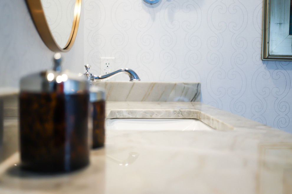 Mid-sized transitional master white tile and marble tile ceramic tile and gray floor alcove bathtub photo with gray walls, beaded inset cabinets, white cabinets, a two-piece toilet, an undermount sink, quartzite countertops and a hinged shower door