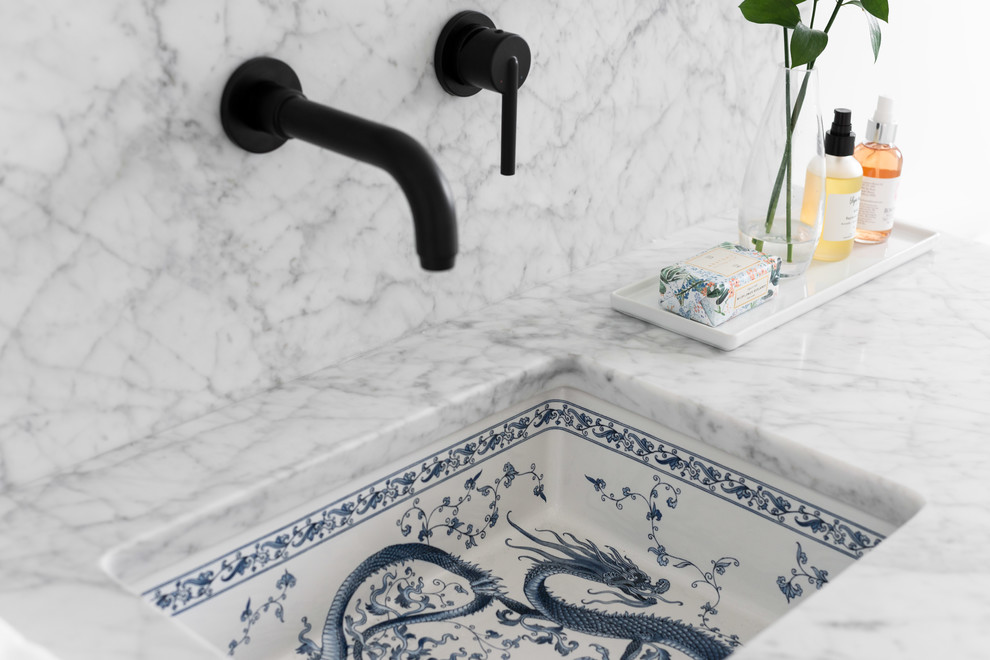 Mid-sized transitional home design photo with an undermount sink and marble countertops