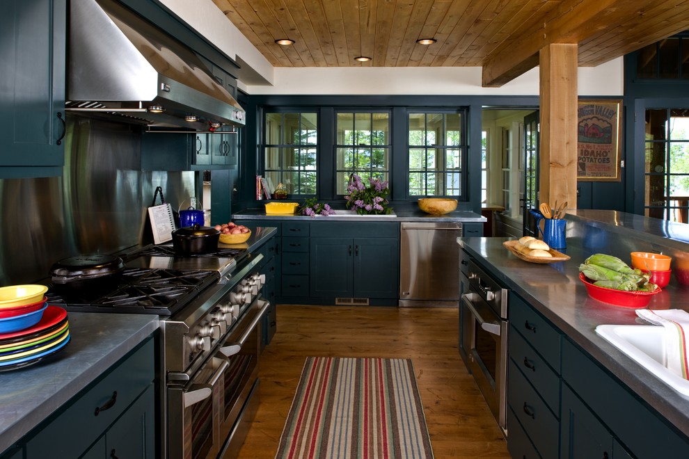 Inspiration for a country kitchen in Other with stainless steel appliances.
