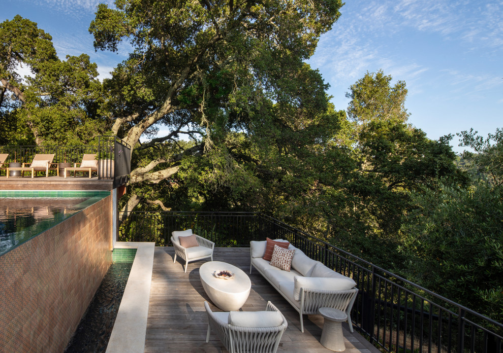 Inspiration for a mid-sized mediterranean side yard ground level metal railing water fountain deck remodel in San Francisco