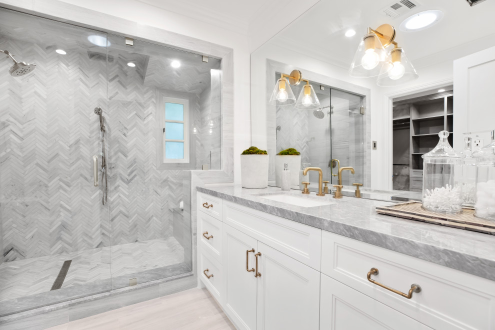 Design ideas for a transitional bathroom in Los Angeles with recessed-panel cabinets, white cabinets, an alcove shower, gray tile, white walls, light hardwood floors, an undermount sink, beige floor, a hinged shower door, grey benchtops, a shower seat, a single vanity and a built-in vanity.