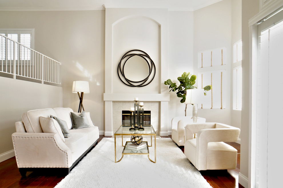 Inspiration for a mid-sized transitional formal open concept living room in Atlanta with grey walls, medium hardwood floors, a standard fireplace, a tile fireplace surround and no tv.