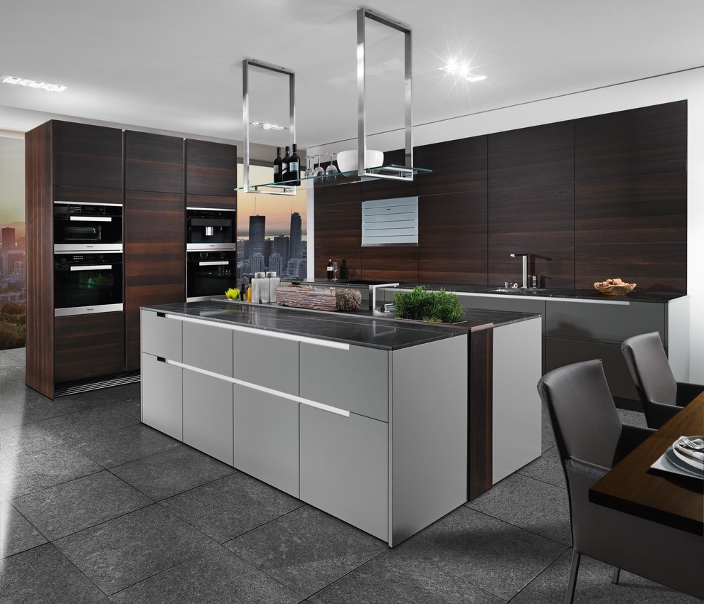 Inspiration for a mid-sized contemporary l-shaped eat-in kitchen in Miami with an undermount sink, flat-panel cabinets, dark wood cabinets, limestone benchtops, brown splashback, timber splashback, stainless steel appliances, ceramic floors and with island.