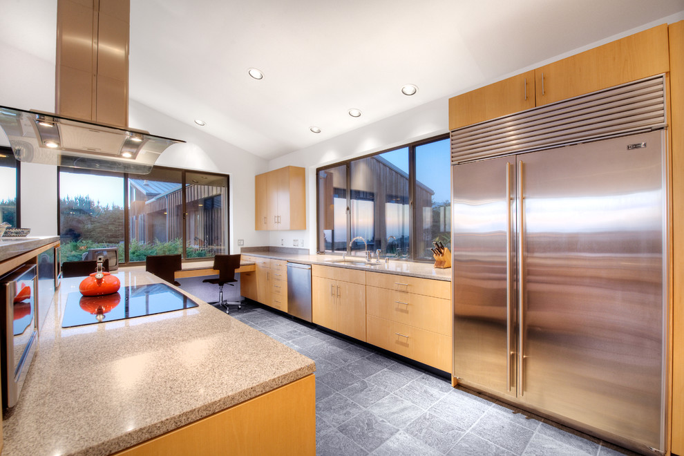 Design ideas for a large contemporary single-wall eat-in kitchen in San Francisco with a double-bowl sink, flat-panel cabinets, light wood cabinets, quartz benchtops, grey splashback, stone slab splashback, stainless steel appliances, slate floors and with island.