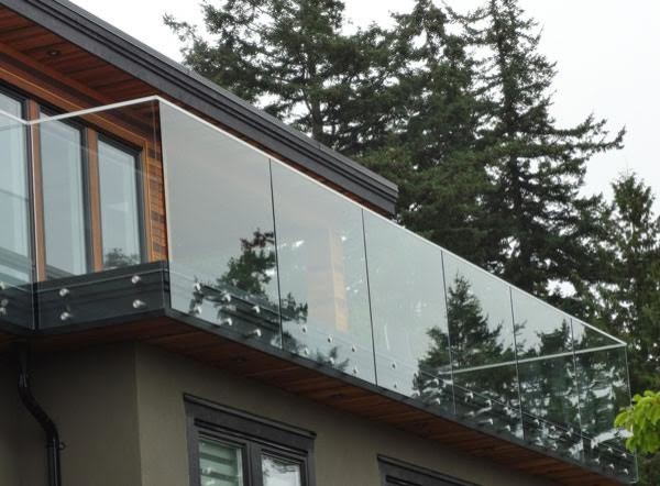 Example of a mid-sized mountain style brown two-story mixed siding gable roof design in Toronto