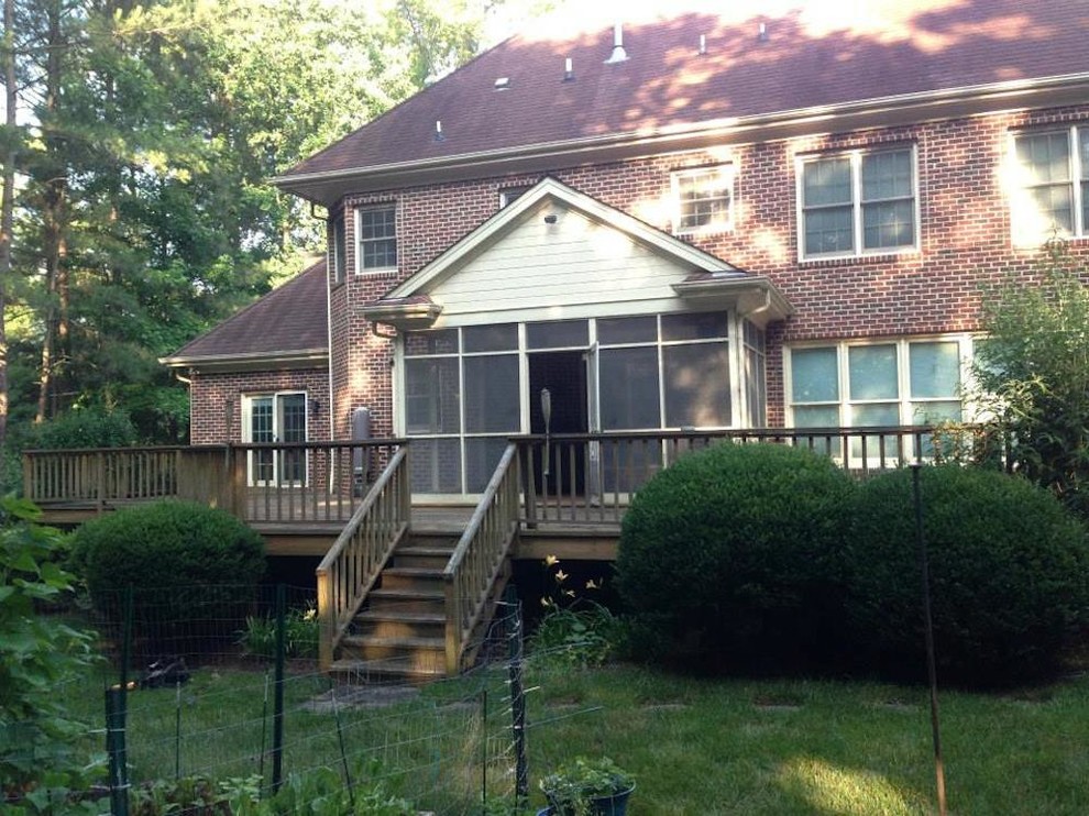 Example of a mid-sized transitional backyard deck design in Raleigh with no cover