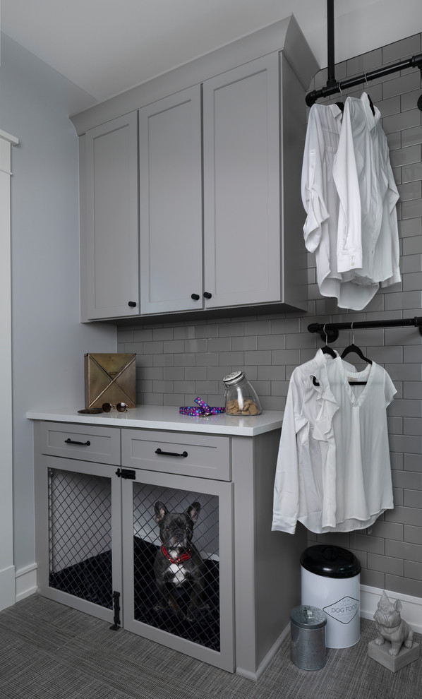 Inspiration for a large transitional utility room in Other with grey cabinets, solid surface benchtops, grey walls, grey floor and white benchtop.