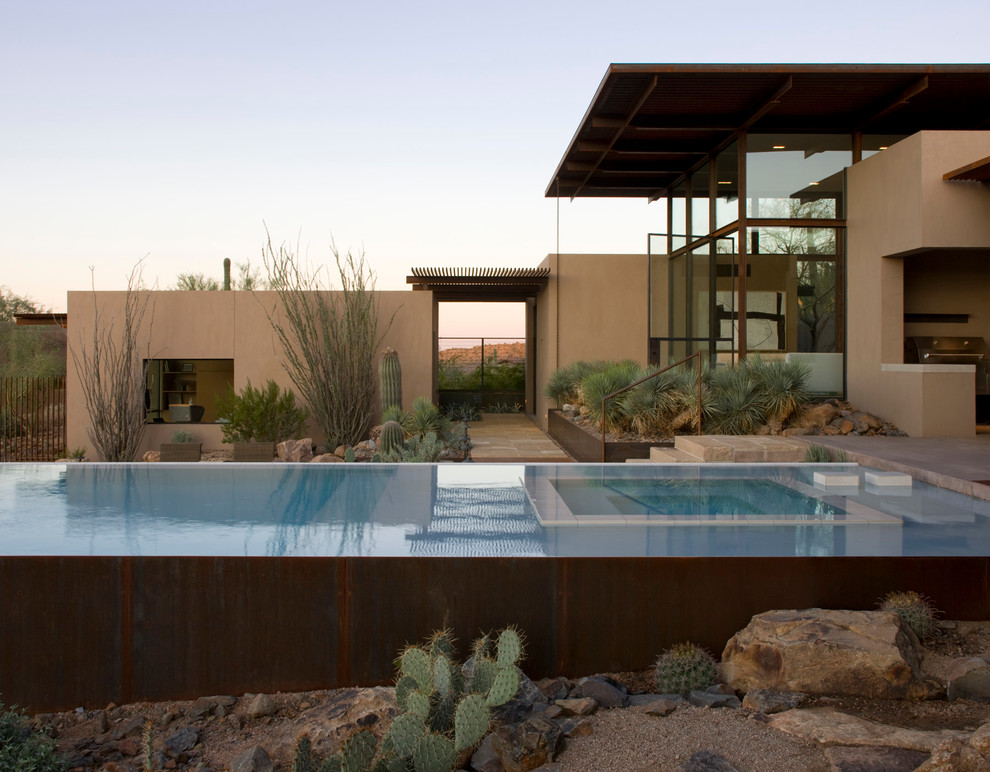 Inspiration for a contemporary rectangular infinity pool in Austin.