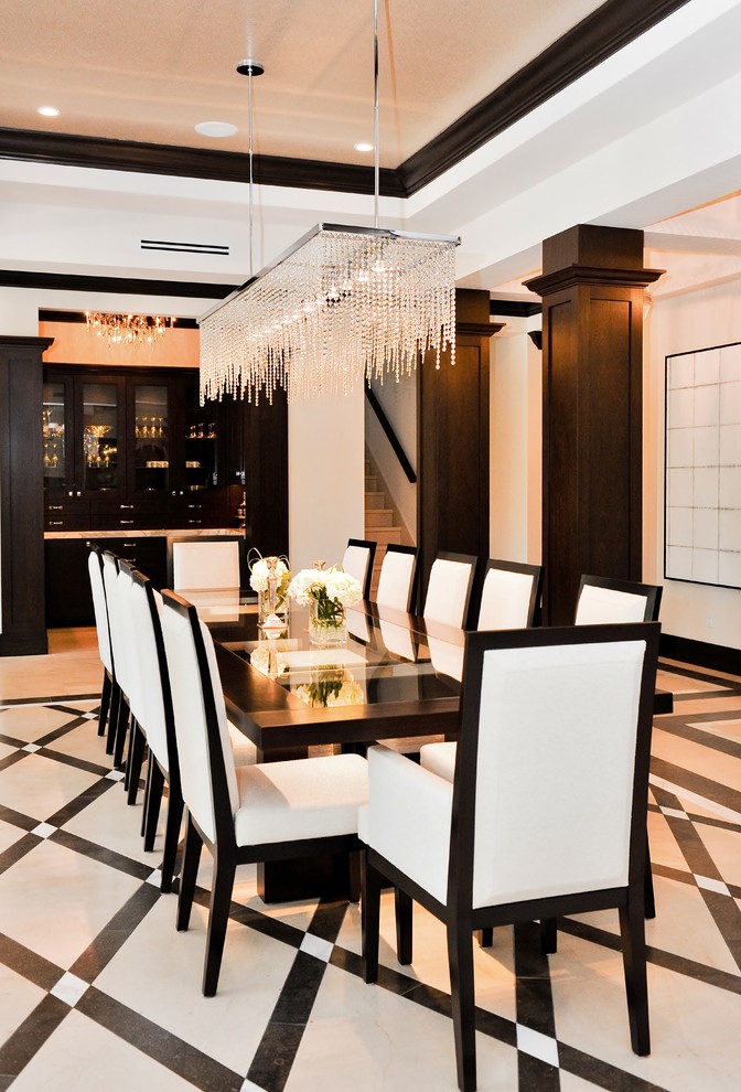 This is an example of a contemporary dining room in Miami with white walls and multi-coloured floor.