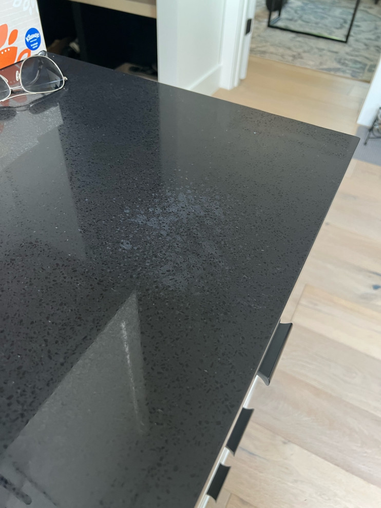 help! need advice regarding discoloration on black quartz countertops