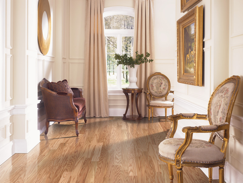 Traditional hallway in Atlanta with light hardwood floors.