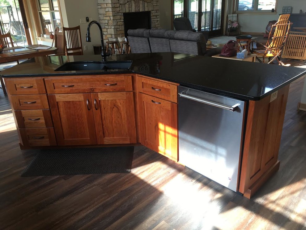 Example of a mountain style kitchen design with granite countertops