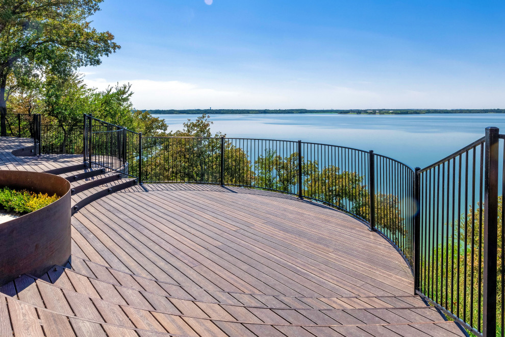 Inspiration for a large modern backyard ground level deck remodel