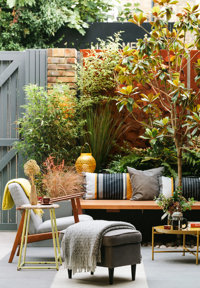 Inspiration for a small contemporary front yard patio in London.