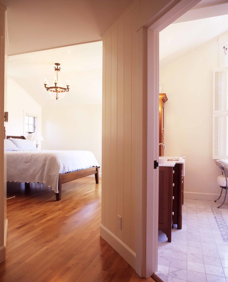 Photo of a mid-sized beach style hallway in San Francisco with white walls and medium hardwood floors.