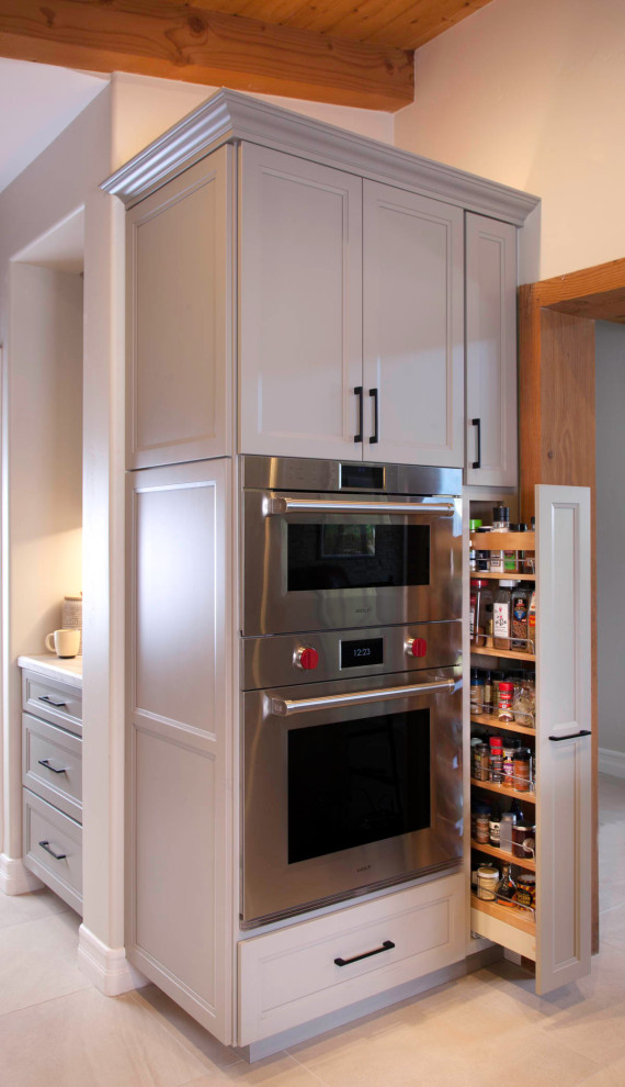 Inspiration for a large rustic galley porcelain tile, gray floor and wood ceiling open concept kitchen remodel in Denver with an undermount sink, recessed-panel cabinets, gray cabinets, quartzite countertops, white backsplash, cement tile backsplash, stainless steel appliances, an island and white countertops