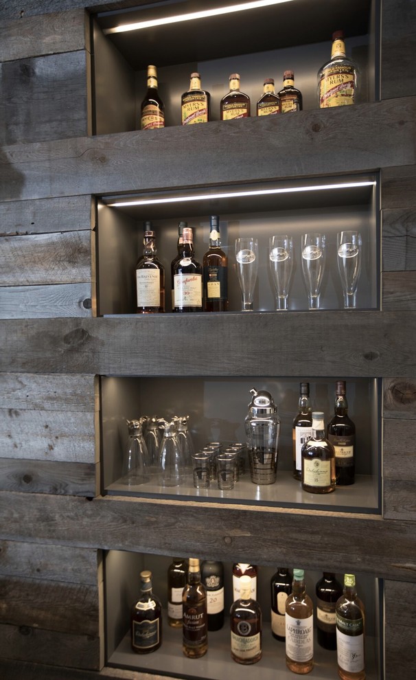 Photo of a transitional home bar in Calgary.