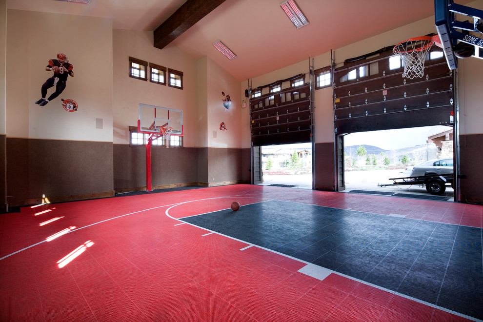 Large traditional indoor sport court in Salt Lake City with multi-coloured walls and red floor.