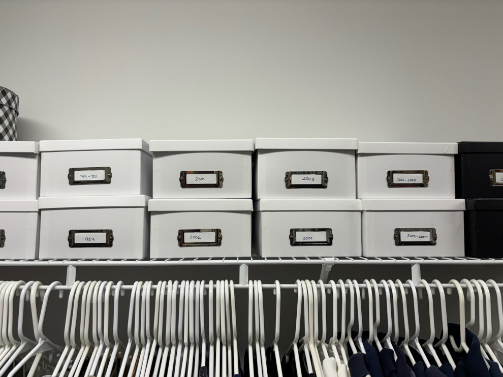 Organized Photo Boxes on a Shelf