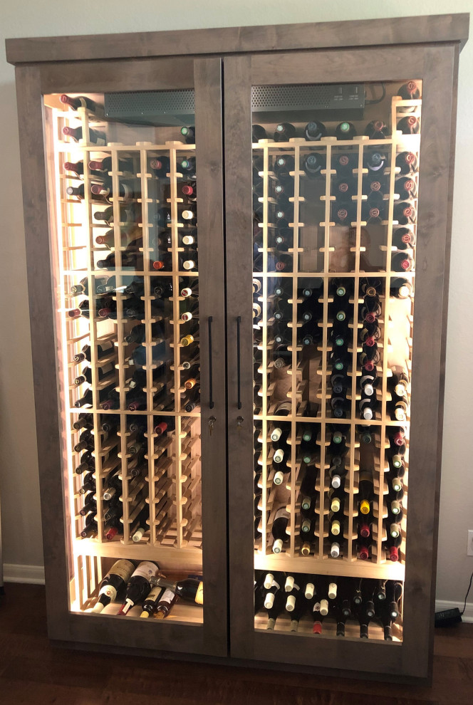 Design ideas for a medium sized midcentury wine cellar in Dallas with storage racks.