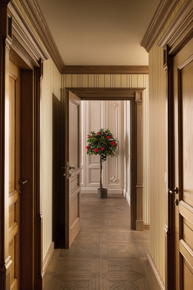Inspiration for a traditional hallway in Moscow with beige walls and medium hardwood floors.