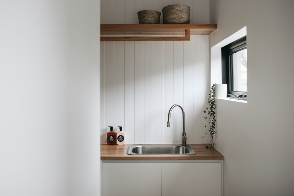Design ideas for a contemporary laundry room in Adelaide.
