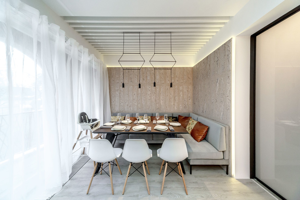 Small contemporary kitchen/dining combo in Moscow with beige walls.