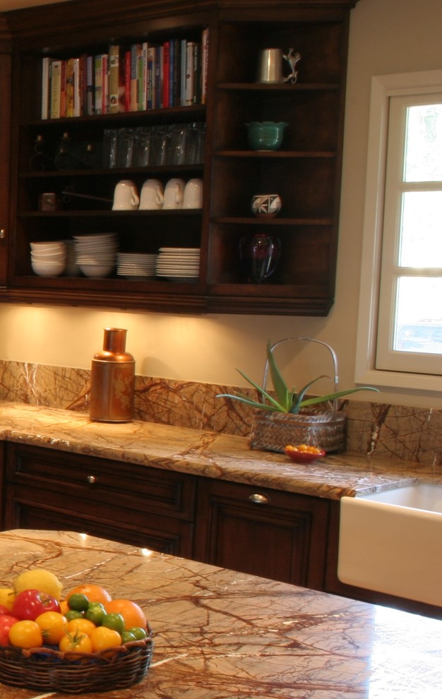Inspiration for a large transitional u-shaped terra-cotta tile open concept kitchen remodel with a farmhouse sink, furniture-like cabinets, dark wood cabinets, granite countertops, stone slab backsplash, stainless steel appliances, white walls and an island