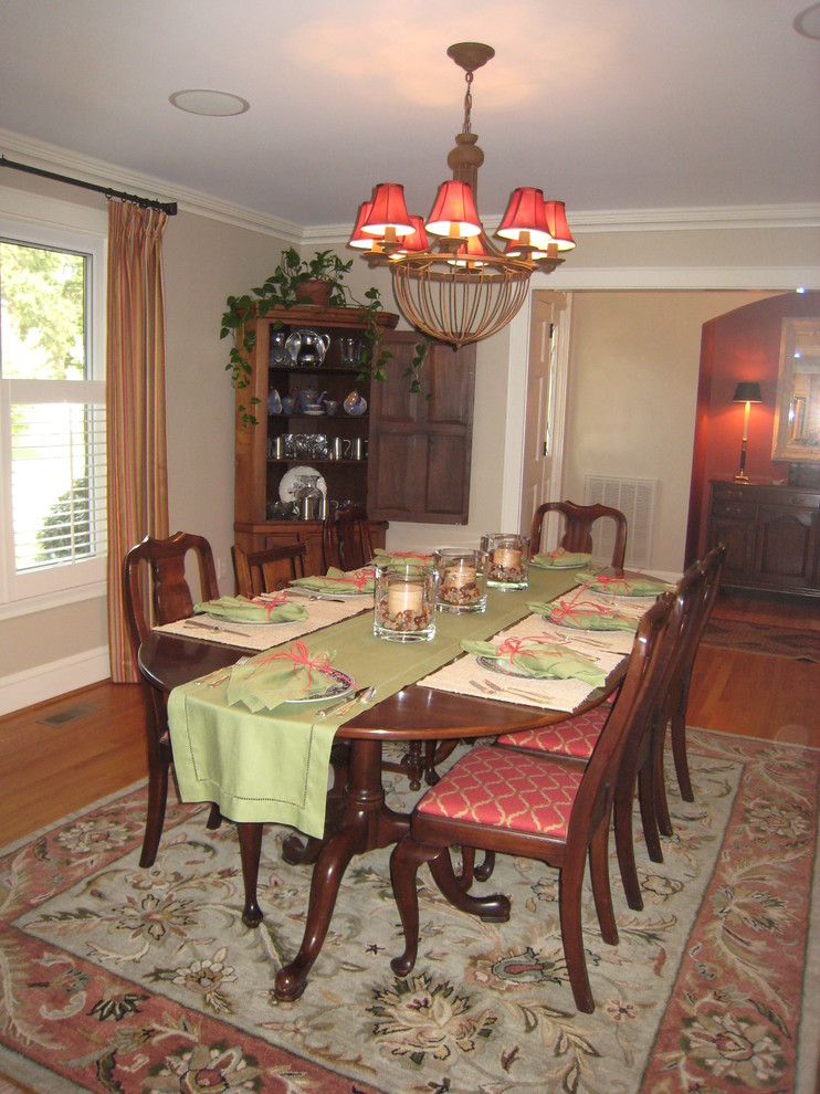 Design ideas for a large traditional separate dining room in Other with grey walls and medium hardwood floors.