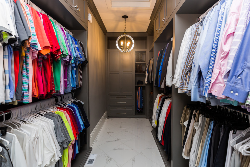 Large traditional men's walk-in wardrobe in Other with flat-panel cabinets, marble floors and grey cabinets.