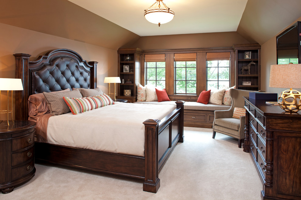 Design ideas for a traditional bedroom in Minneapolis with brown walls and carpet.