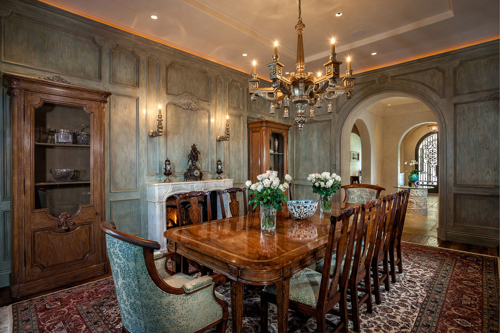 Mediterranean separate dining room in Orange County with a standard fireplace.