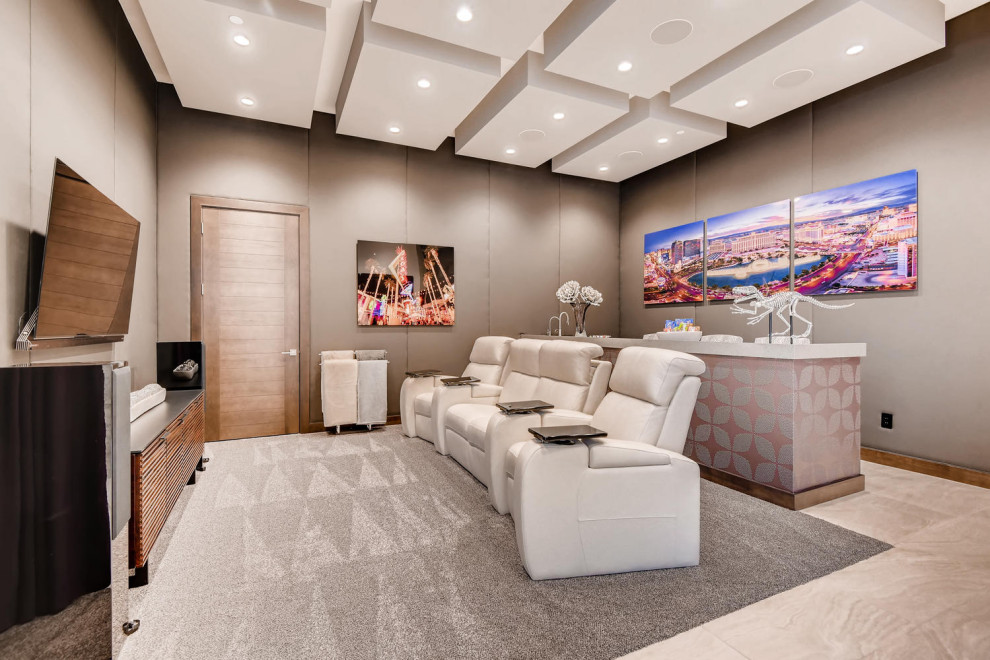 Photo of a large contemporary enclosed home theatre in Las Vegas with grey walls, ceramic floors, a wall-mounted tv and grey floor.