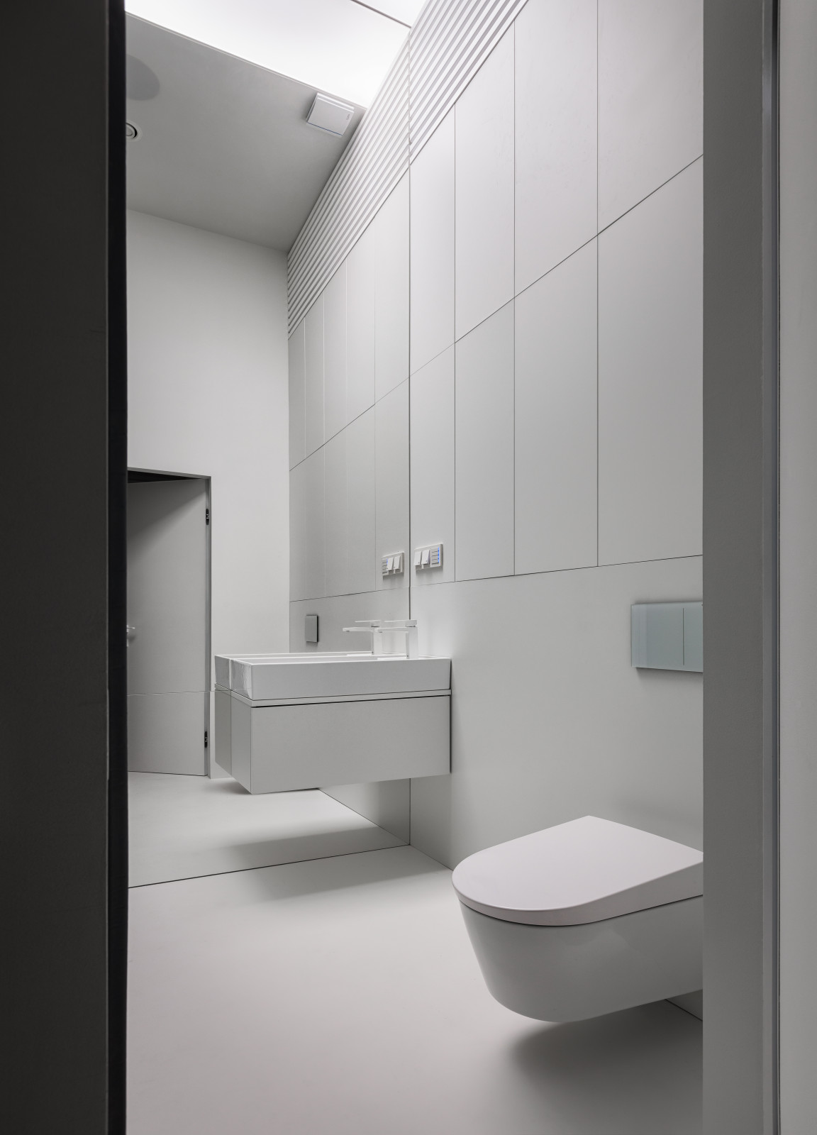 Stylish monochromatic white penthouse