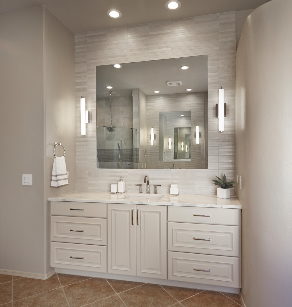 Inspiration for a large traditional master bathroom in Phoenix with raised-panel cabinets, white cabinets, beige tile, porcelain tile, beige walls, porcelain floors, an undermount sink, engineered quartz benchtops and brown floor.