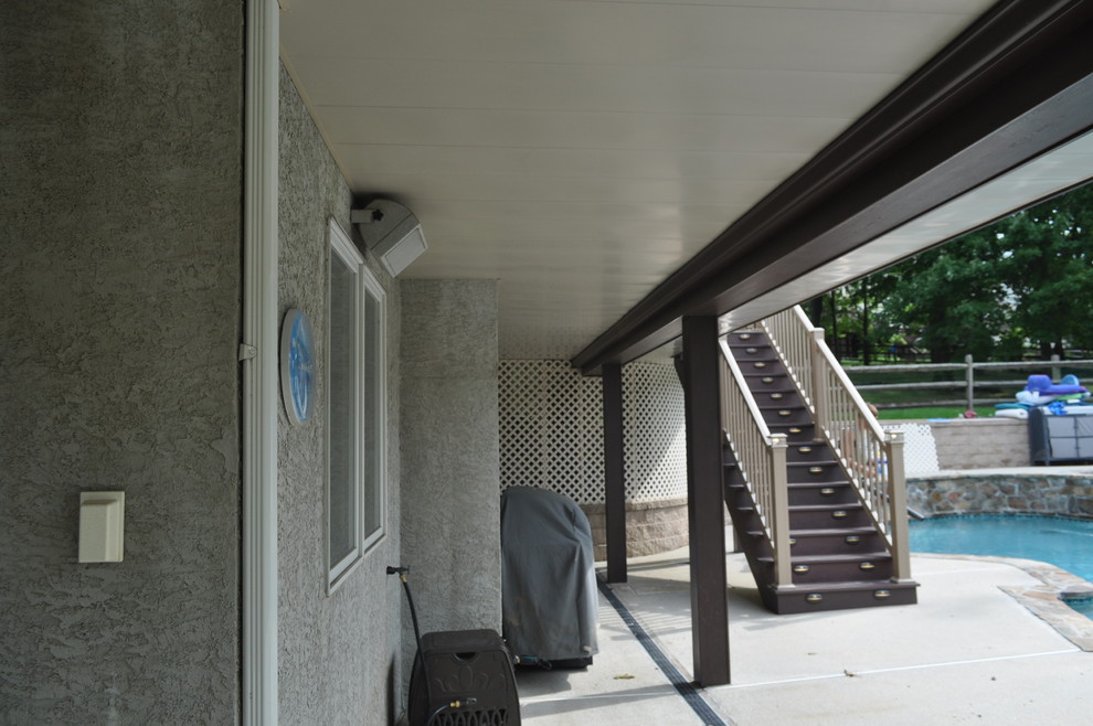 Mid-sized transitional backyard deck photo with no cover