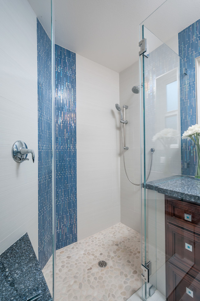 Inspiration for a small beach style master bathroom in San Francisco with an undermount sink, raised-panel cabinets, dark wood cabinets, engineered quartz benchtops, a corner shower, blue tile, glass tile, grey walls and porcelain floors.