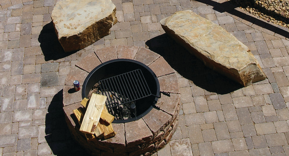 Example of a mid-sized backyard concrete paver patio design in Denver with a fire pit and no cover
