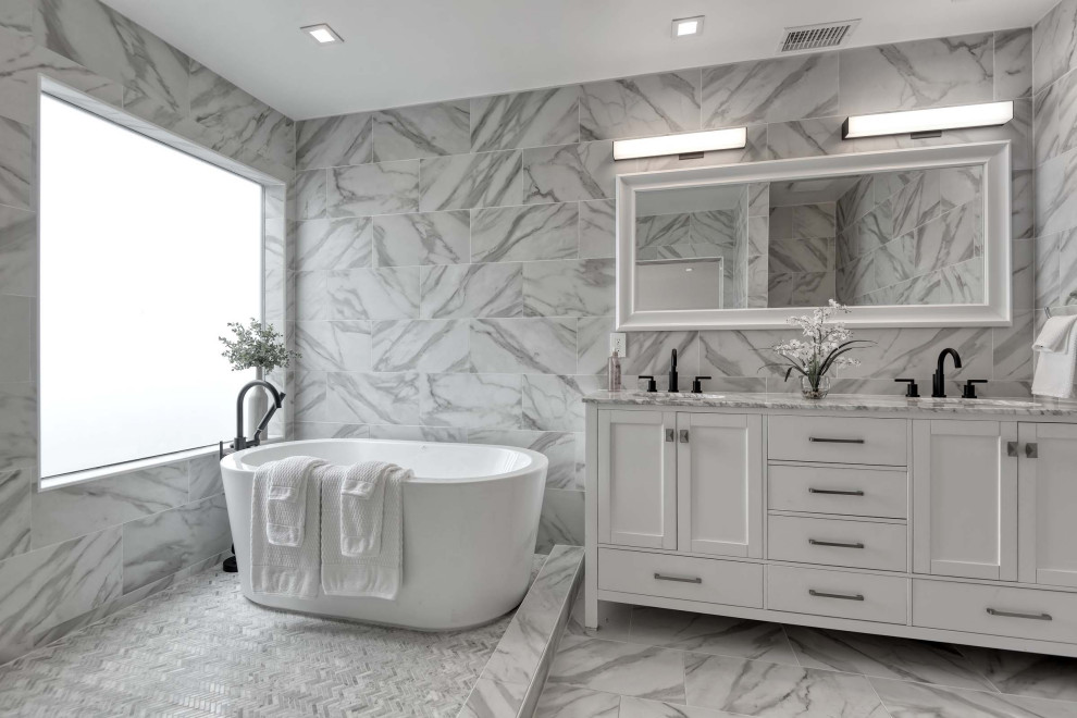 Mid-sized transitional master wet room bathroom in San Diego with shaker cabinets, white cabinets, a freestanding tub, gray tile, porcelain tile, an undermount sink, grey floor and grey benchtops.